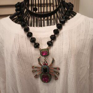 Heidi Daus "Heidi Long Legs" spider design drop necklace.